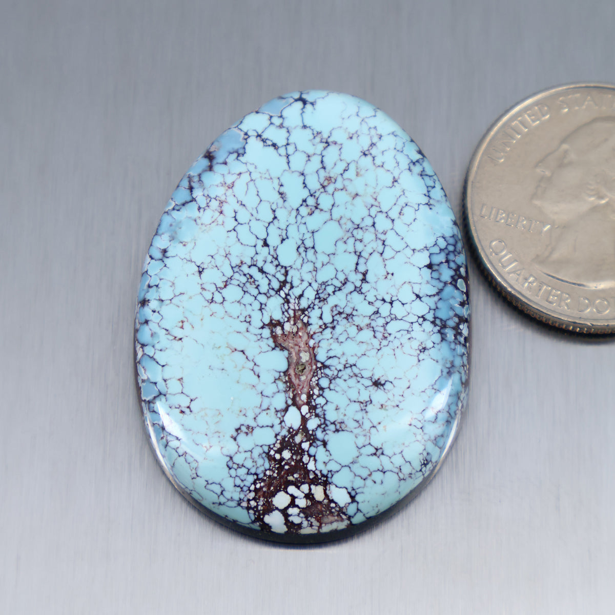 Oval blue turquoise cabochon with brown matrix, polished cab.