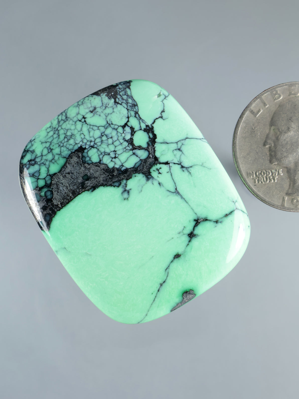 Mint green variscite cabochon with turquoise and dark rocky matrix, oval-square shape