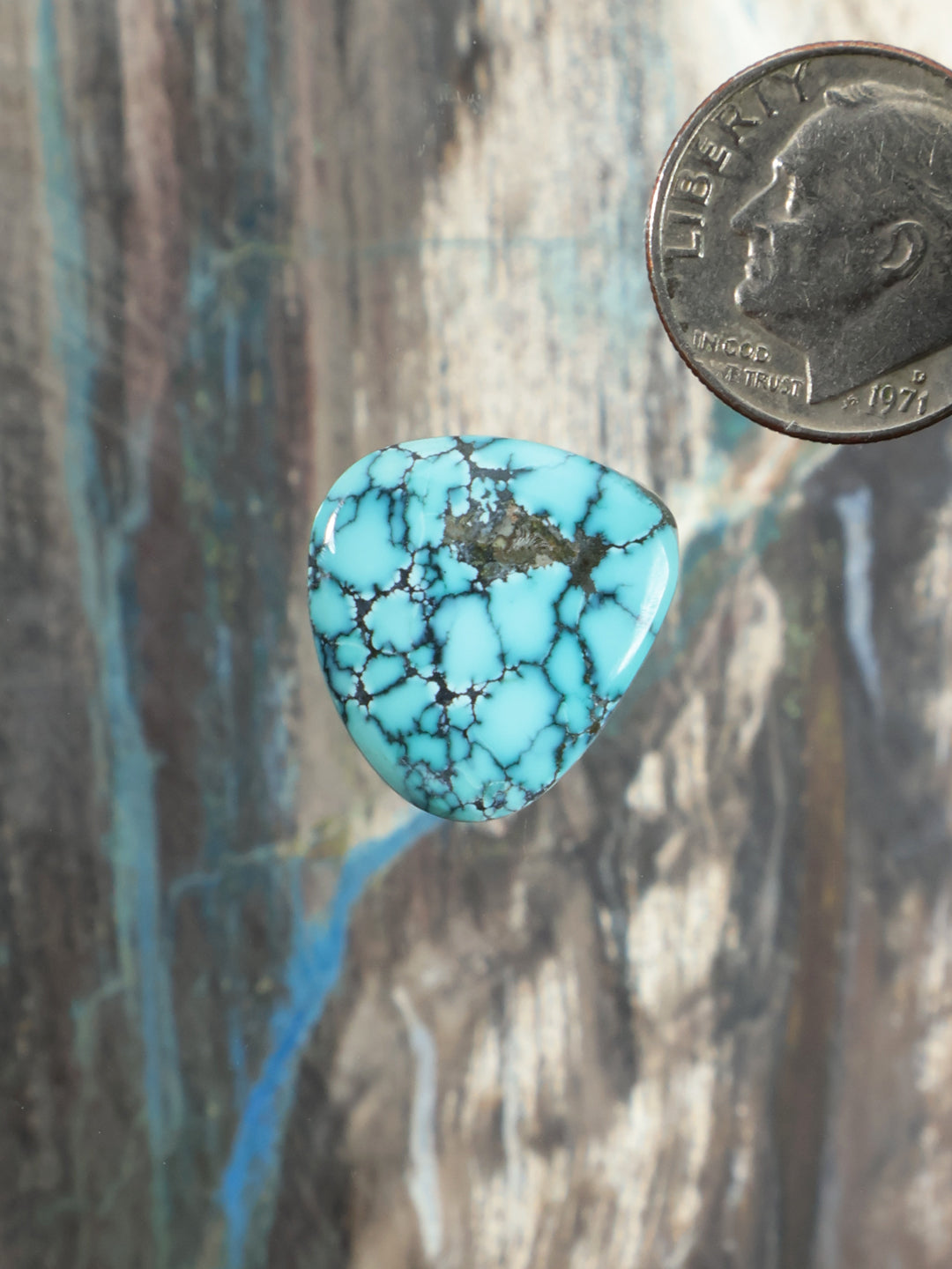 Turquoise cabochon gemstone with dark web matrix, teardrop shape