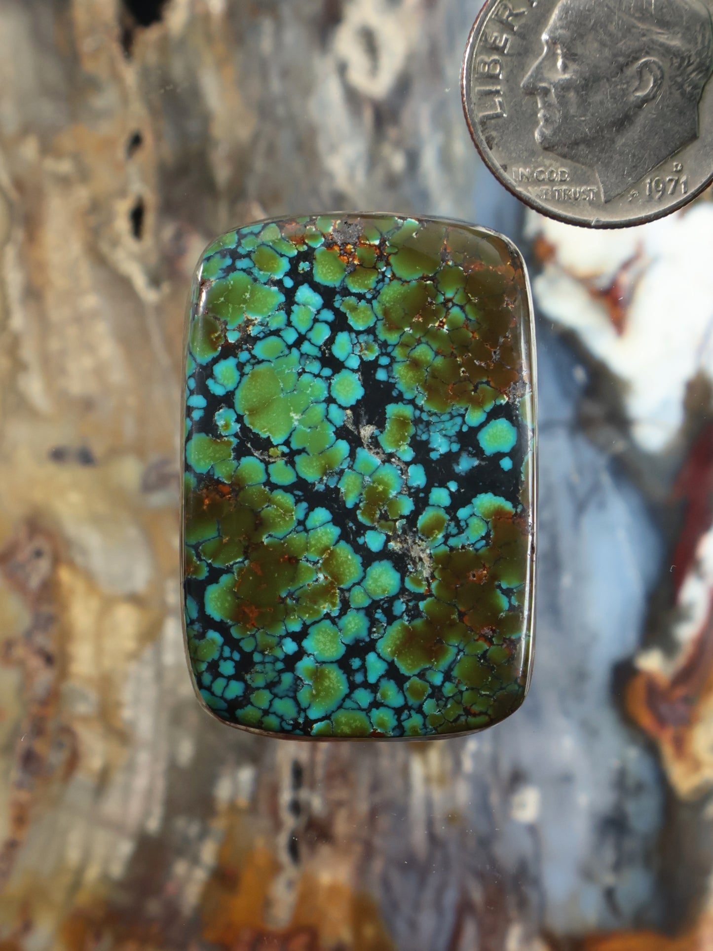 Turquoise cabochon gemstone with blue, green matrix pattern, oval rectangular shape