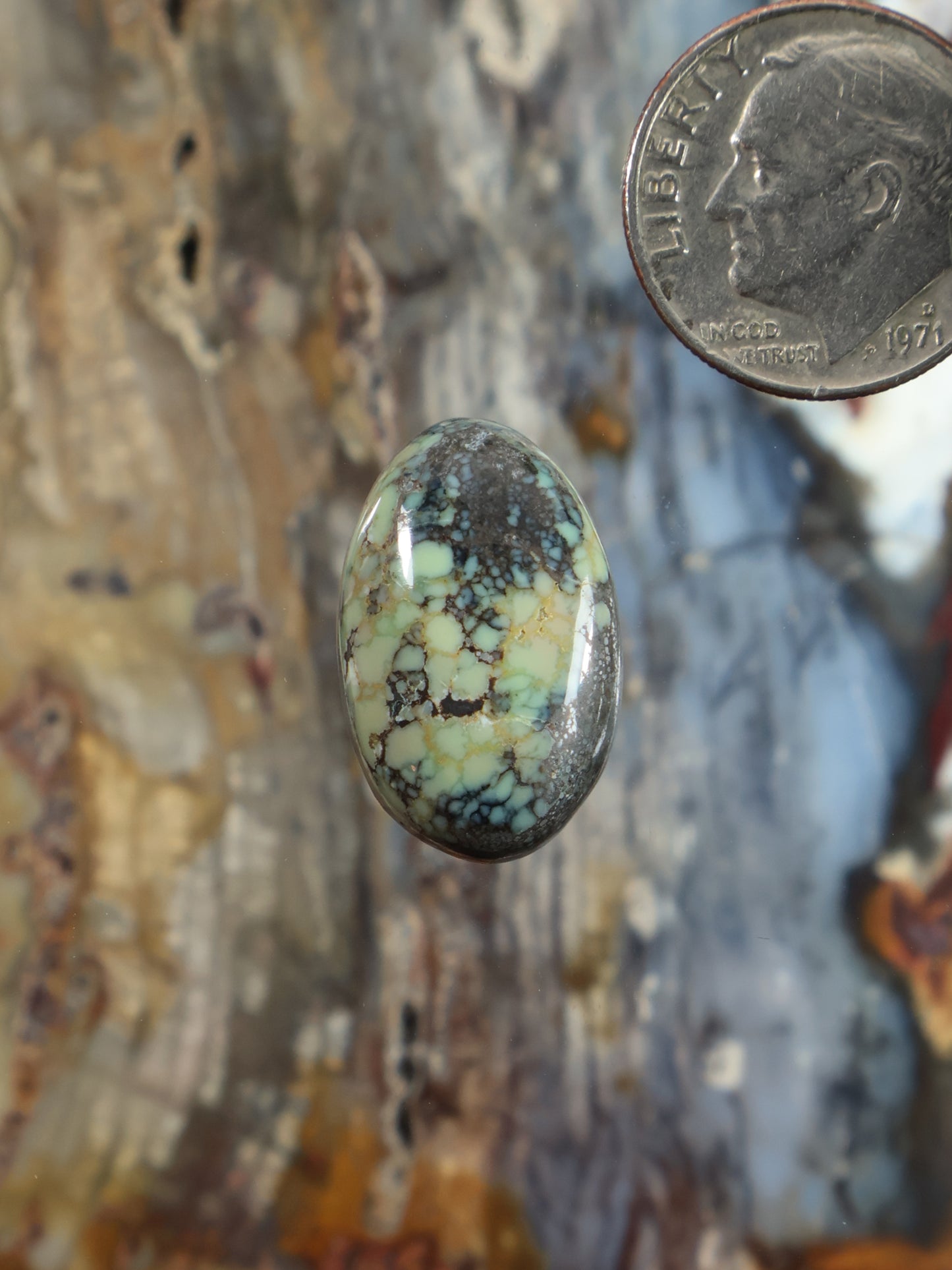 Oval variscite cabochon with green and yellow veined pattern