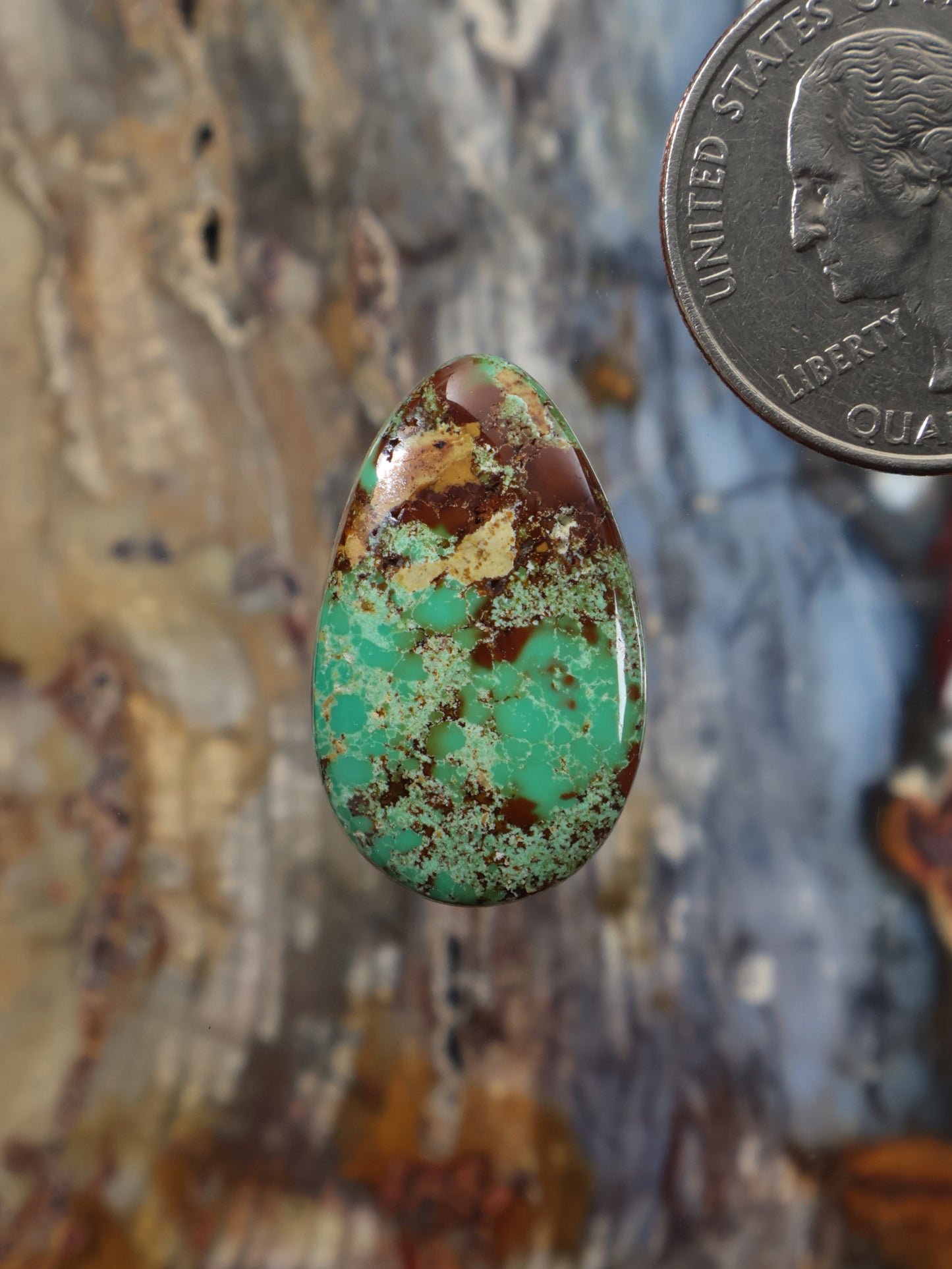 Royston turquoise cabochon D411, teardrop with green-blue and brown speckled matrix