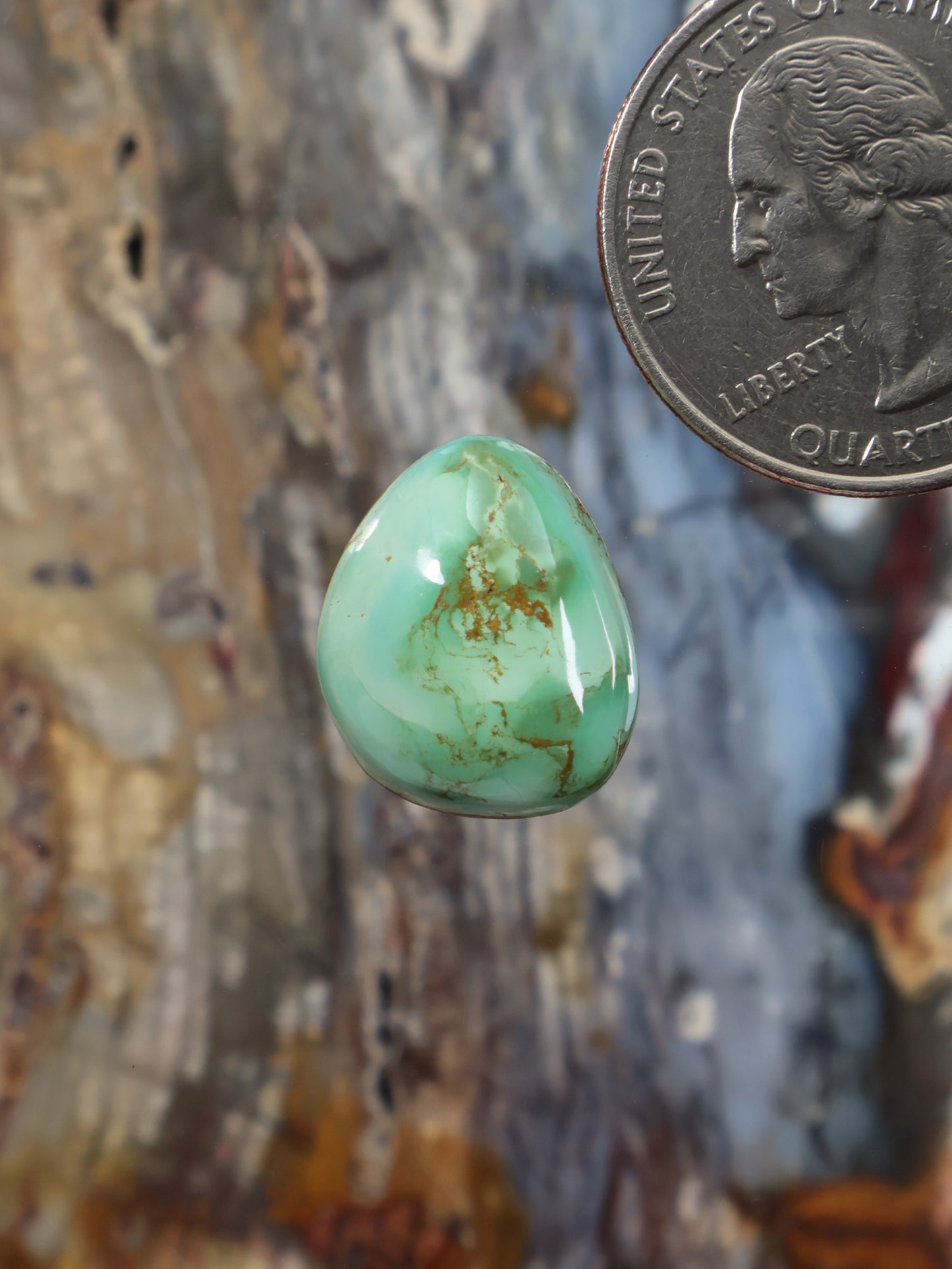 Turquoise cabochon gemstone, oval domed light green with natural matrix inclusions