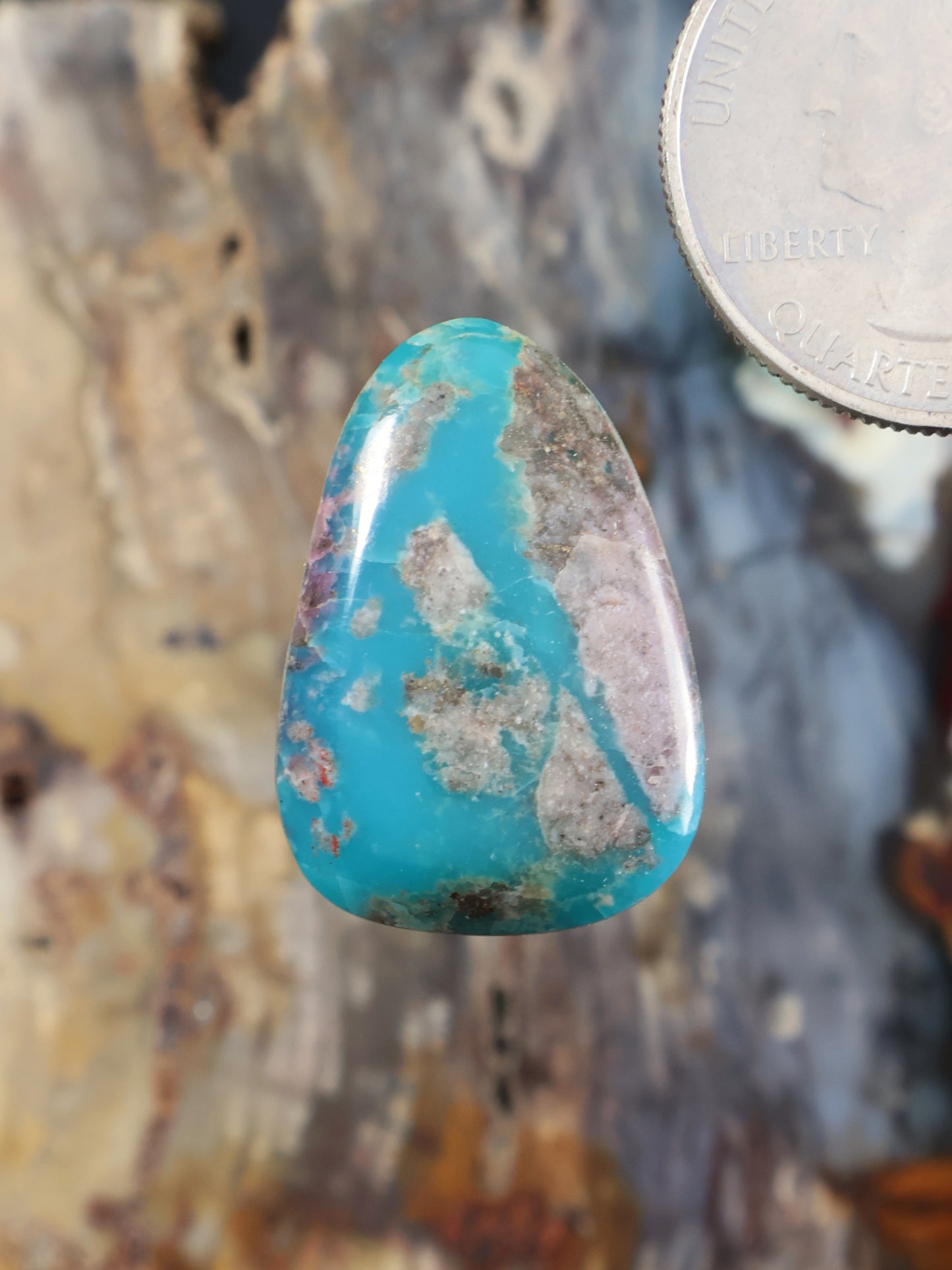 Morenci turquoise cabochon with teardrop shape and natural matrix veining