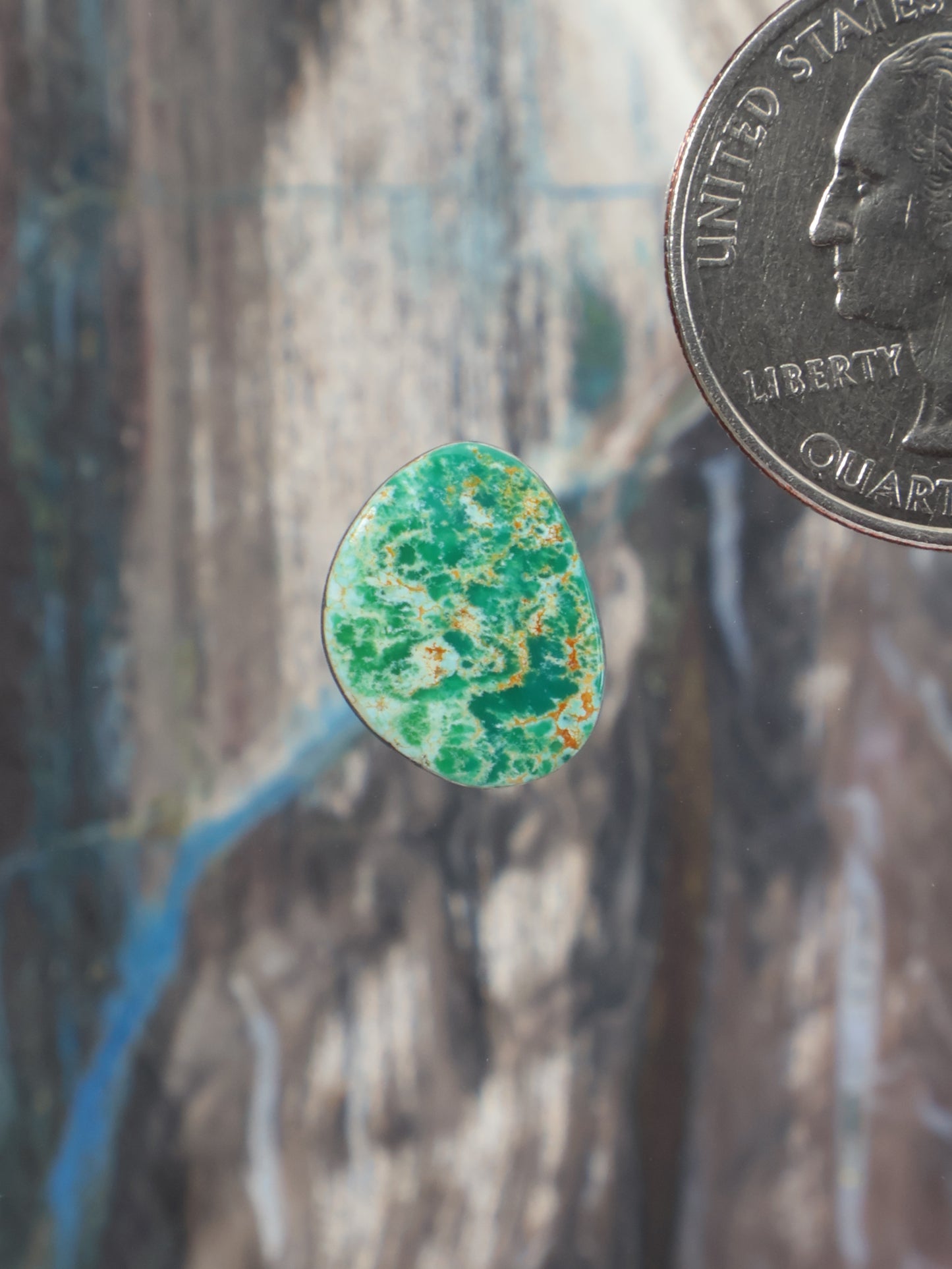Turquoise cabochon with green speckled pattern, teardrop shape