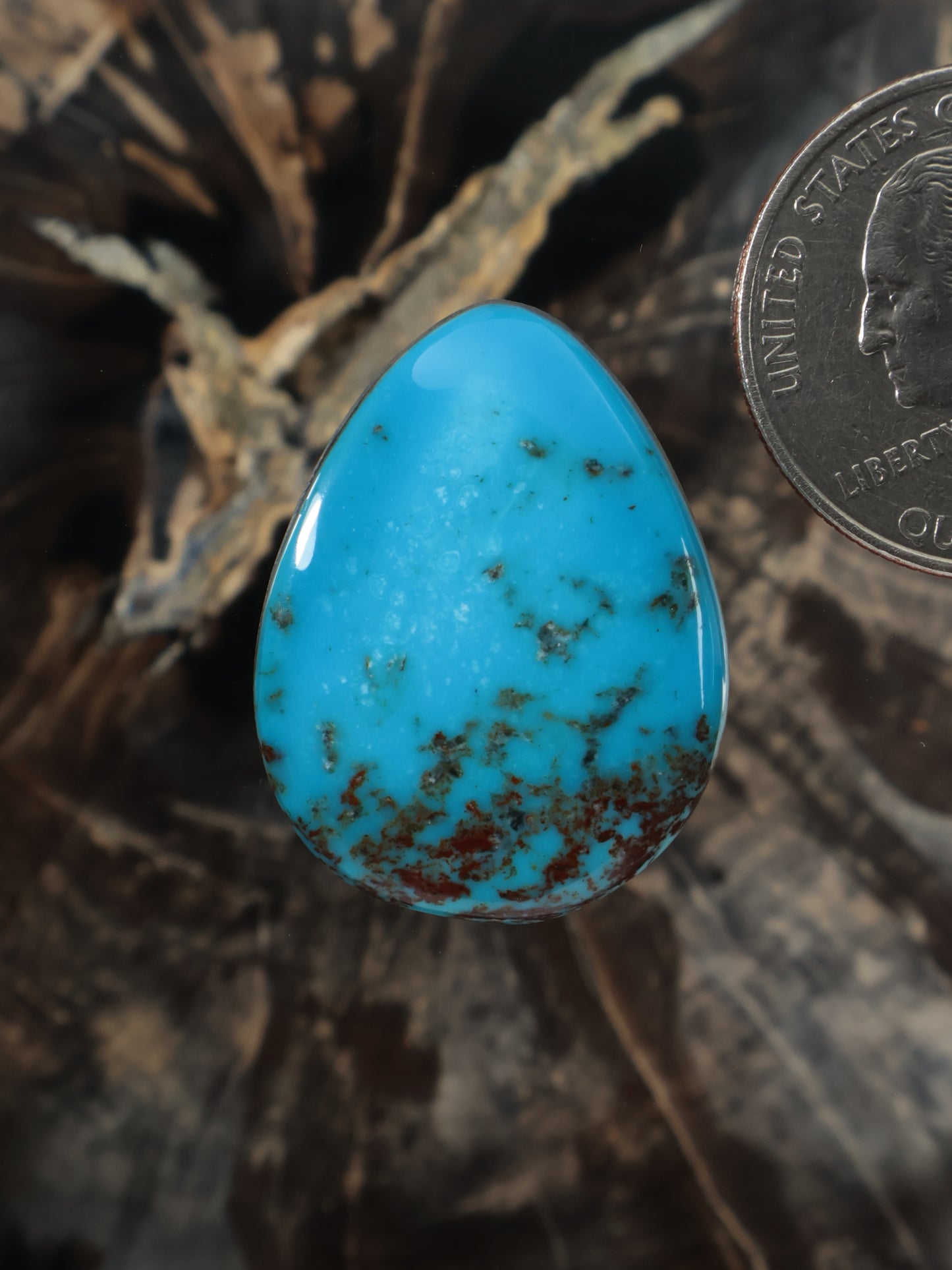 Hubei turquoise cabochon, teardrop oval gemstone with blue and dark matrix inclusions