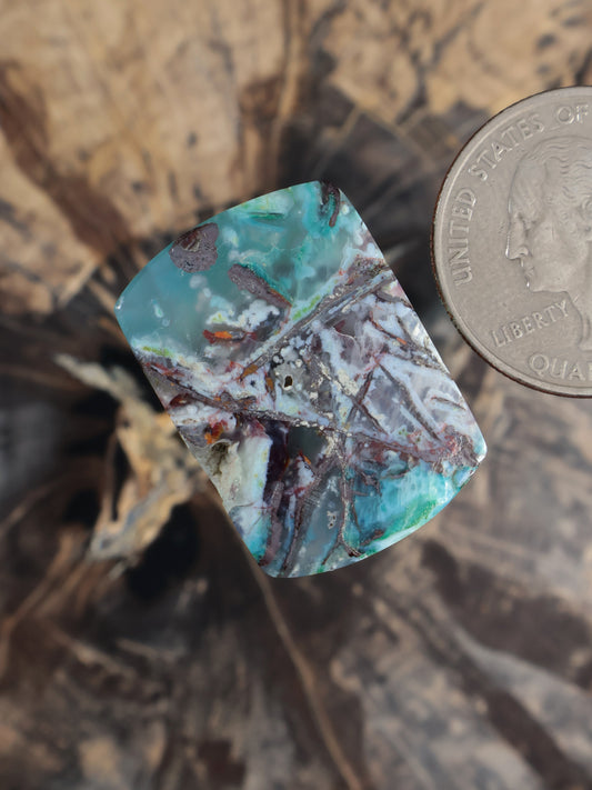 Chrysocolla chalcedony cabochon, turquoise with multicolor stone matrix veining, angled