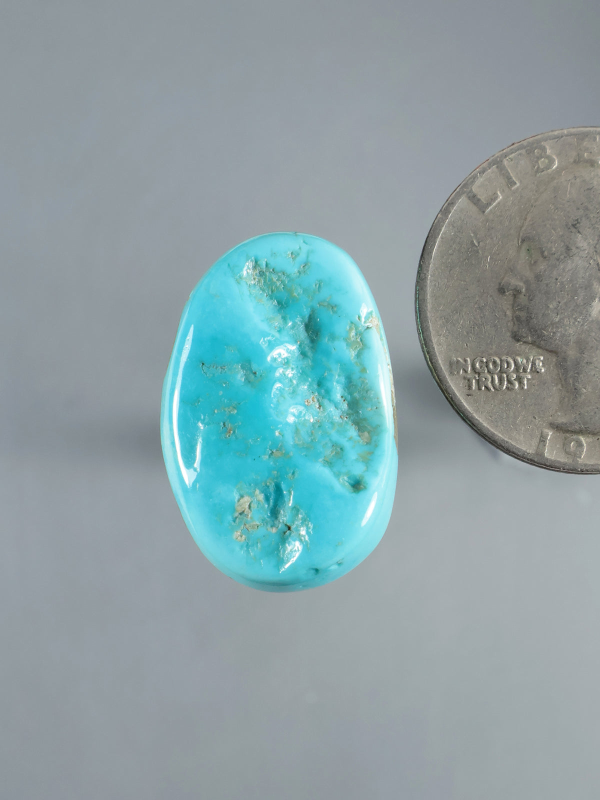 Natural Sleeping Beauty turquoise cabochon, oval polished stone with blue-green matrix