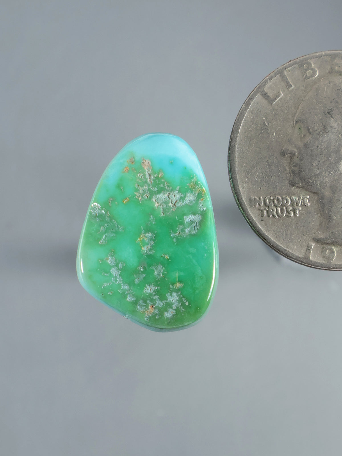 Natural Sleeping Beauty turquoise cabochon, irregular oval with green and blue tones and matrix