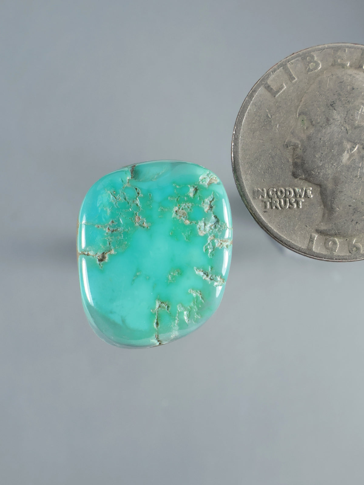 Natural Sleeping Beauty turquoise cabochon, polished irregular oval with brown matrix veining