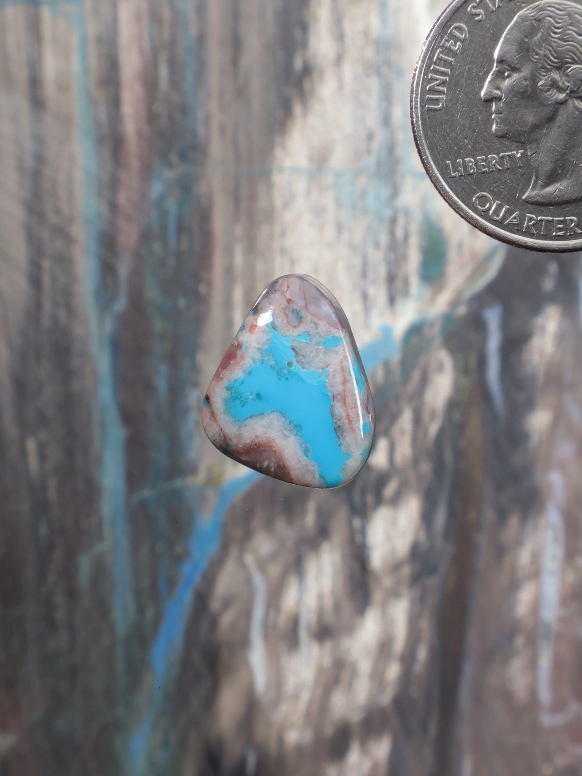 Turquoise cabochon gemstone, teardrop-shaped with blue and brown matrix
