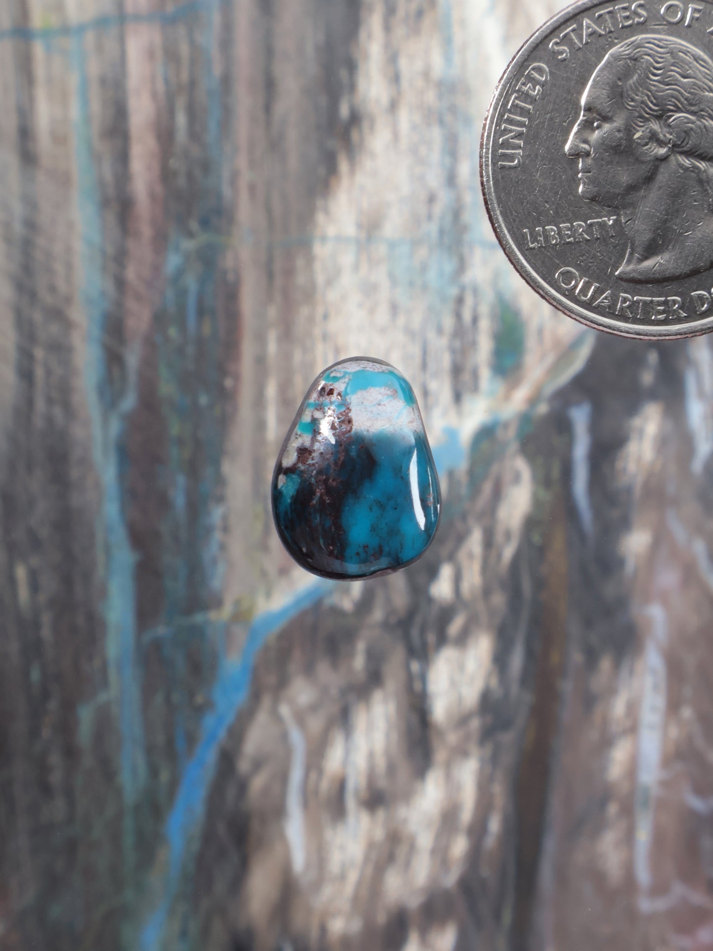 Turquoise cabochon with dark matrix, teardrop oval shape