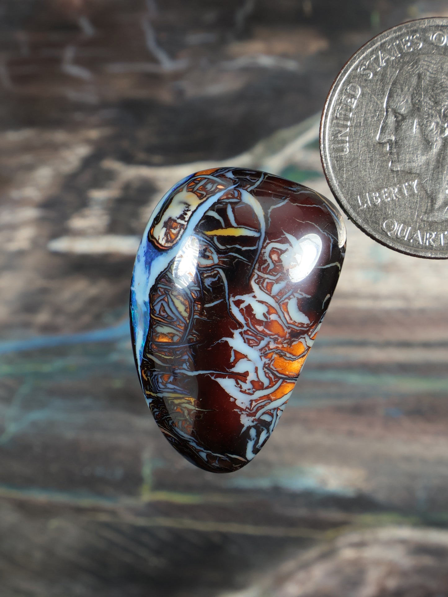 Yowah boulder opal cabochon N738, oval blue and red mottled stone with glossy dome