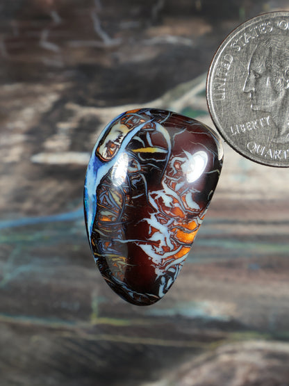 Yowah boulder opal cabochon N738, oval blue and red mottled stone with glossy dome