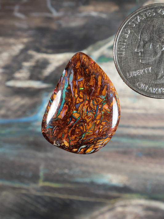 Yowah Boulder Opal cabochon teardrop, amber brown with blue-green flashes
