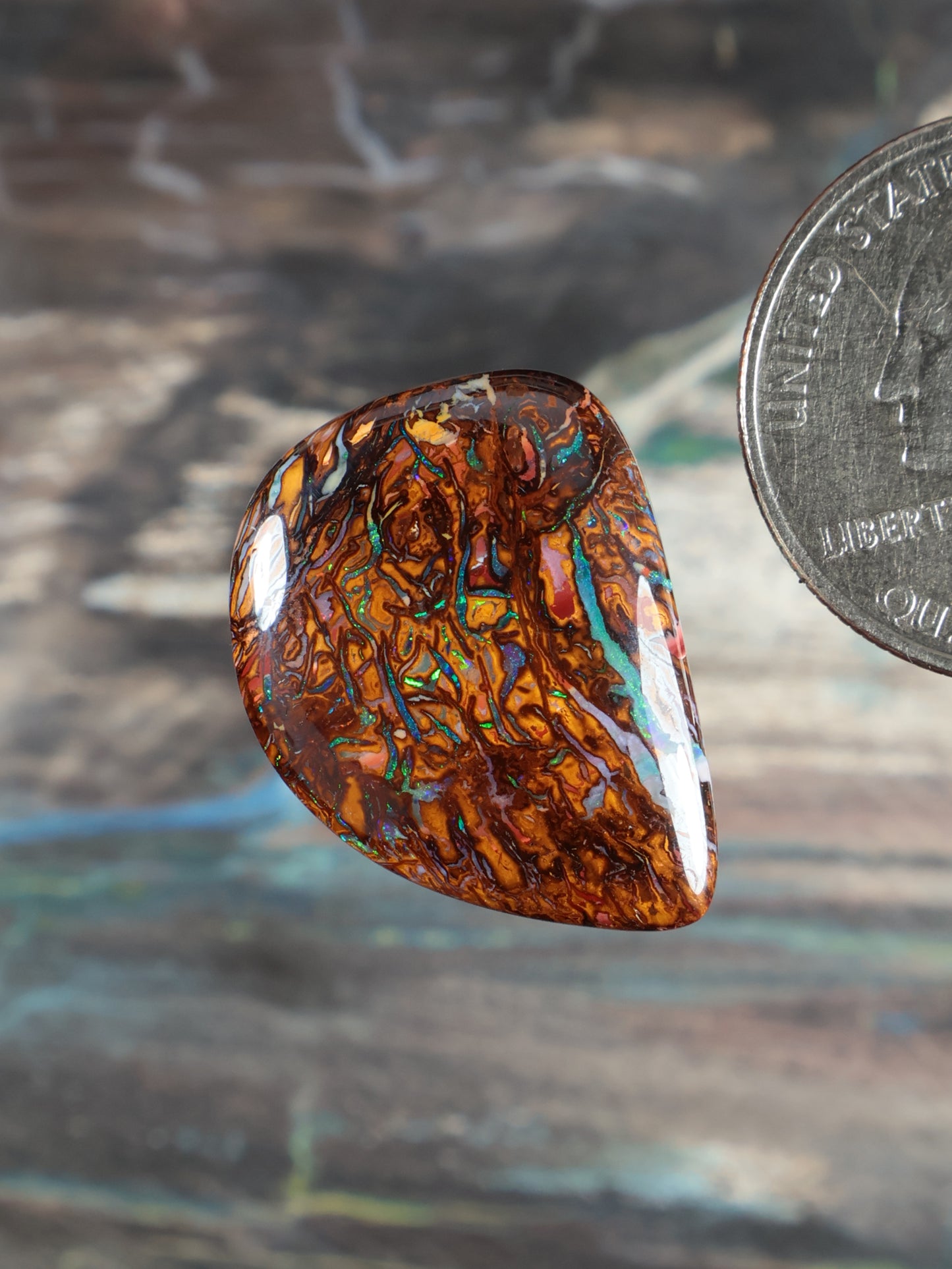 Yowah Boulder Opal cabochon teardrop, orange-brown with iridescent blue-green