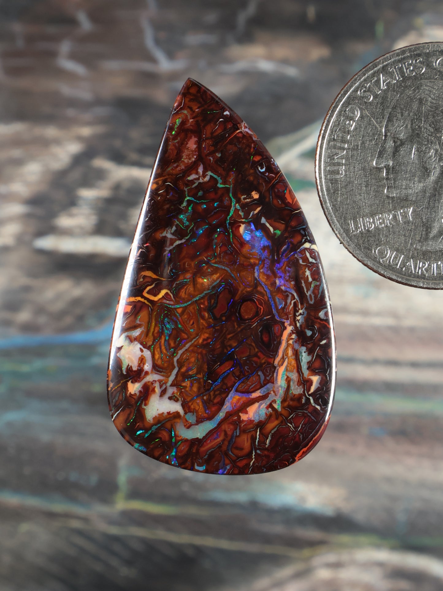 Yowah Boulder Opal cabochon, teardrop shape, reddish-brown with blue-green opal pattern