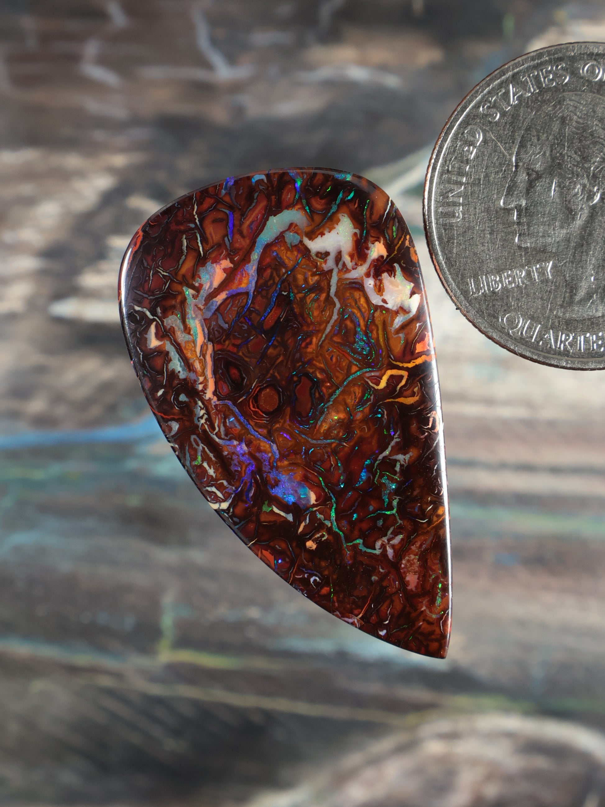 Yowah Boulder Opal cabochon, teardrop shape, dark red-brown with blue-green flashes