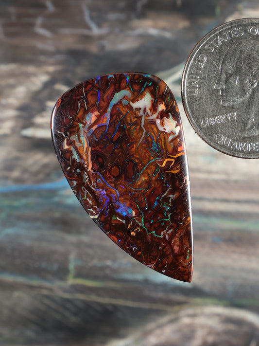Yowah Boulder Opal cabochon, teardrop shape, dark red-brown with blue-green flashes