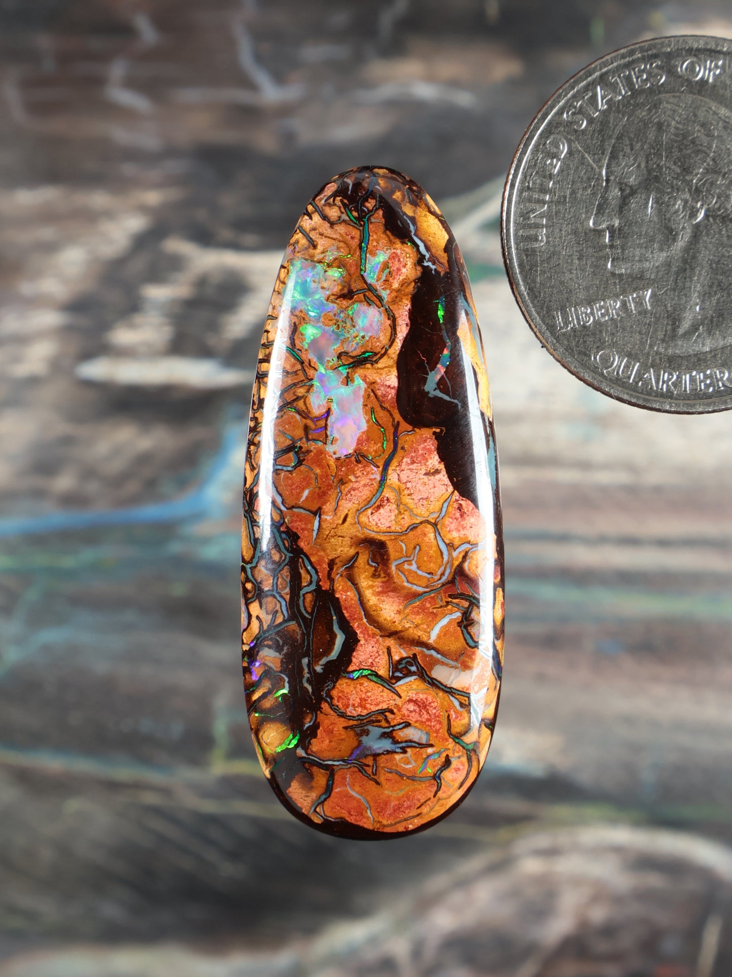 Yowah Boulder Opal cabochon, oval with orange and blue-green flashes, black matrix