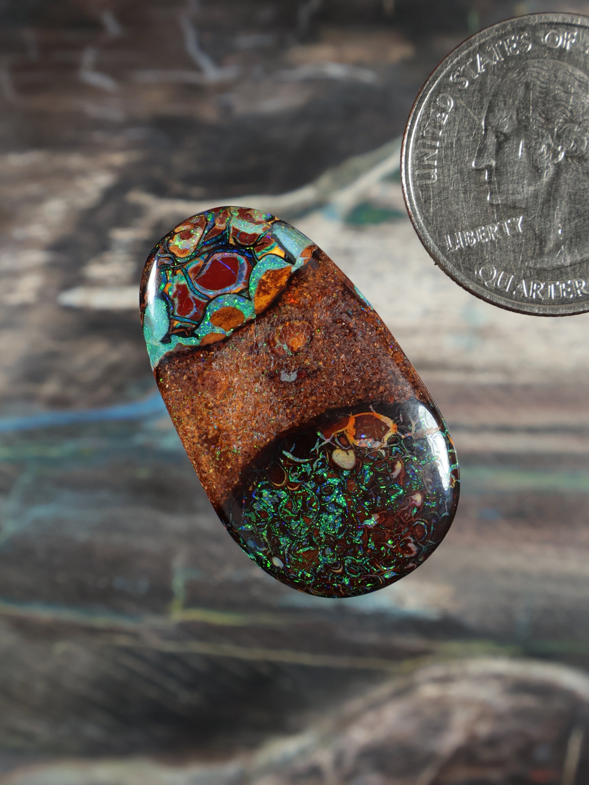 Boulder opal cabochon, oval with orange base and teal/green mosaic top