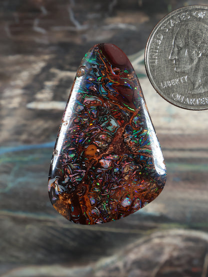 Yowah boulder opal cabochon teardrop, dark base with neon blue-green highlights