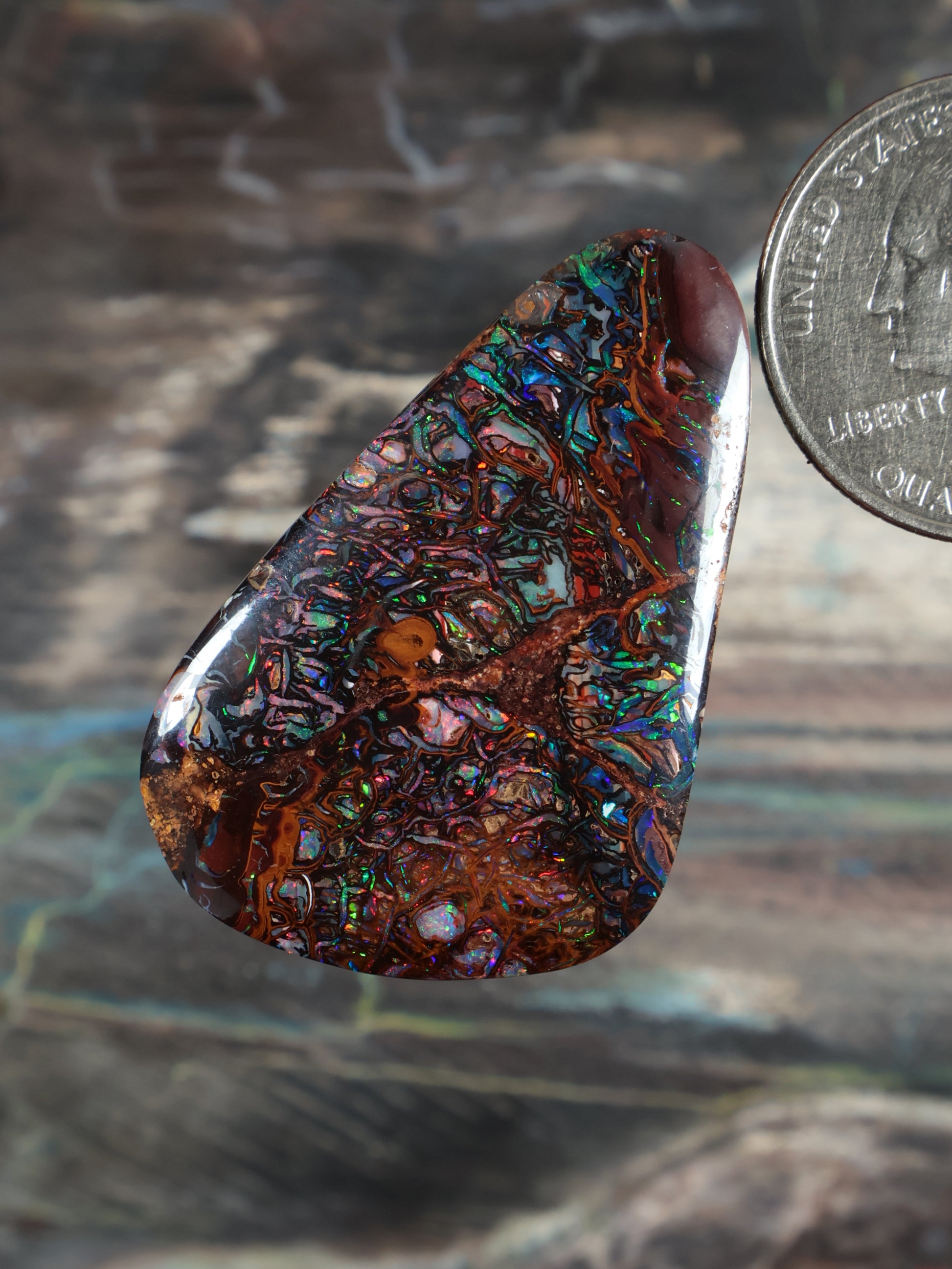 Yowah boulder opal cabochon, teardrop with iridescent blue-green and orange banding