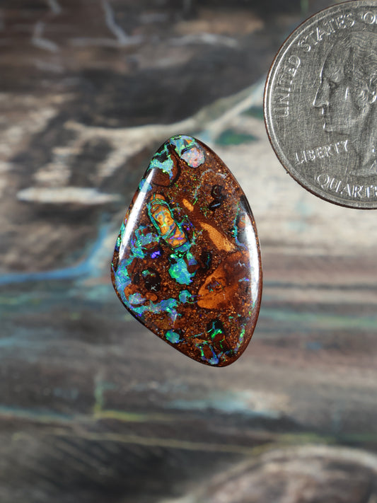 Opal cabochon teardrop with brown matrix and vivid green-blue patches