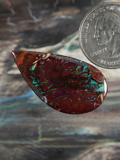 Yowah Boulder Opal cabochon (N739), leaf-teardrop red with vivid green-blue opal glow