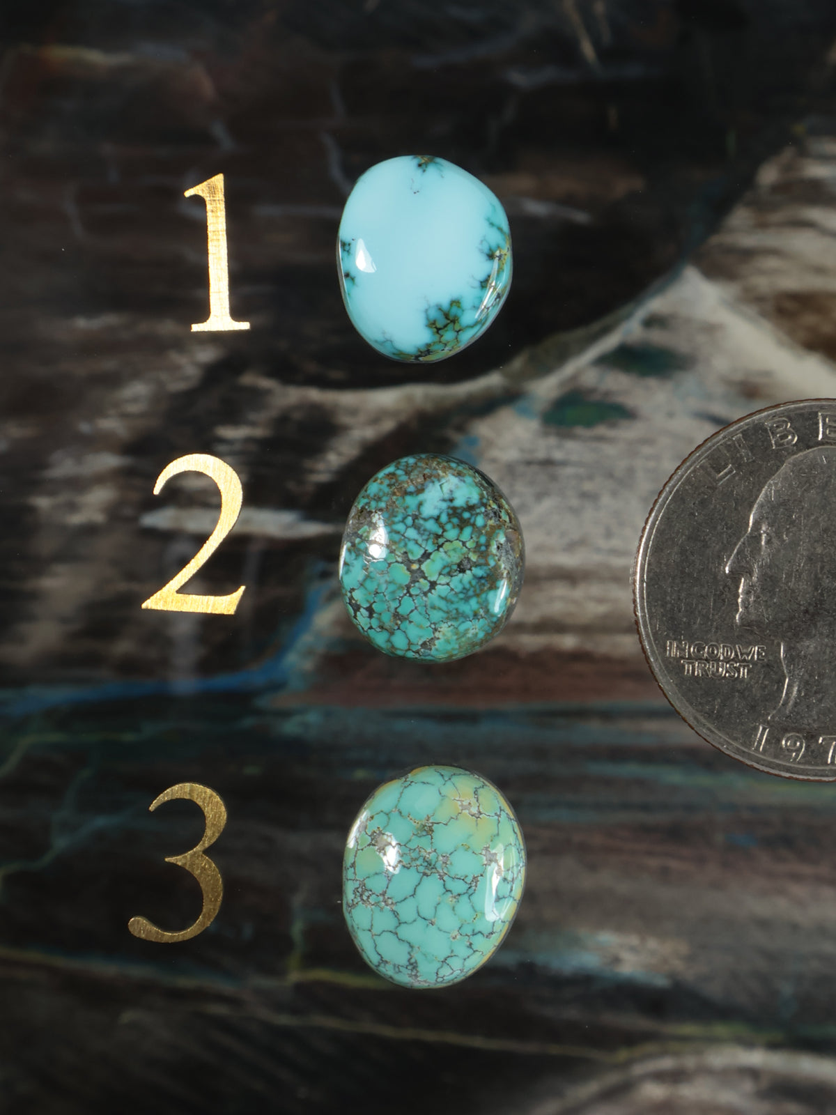 Set of three turquoise oval cabochon gemstones with veined stone finish