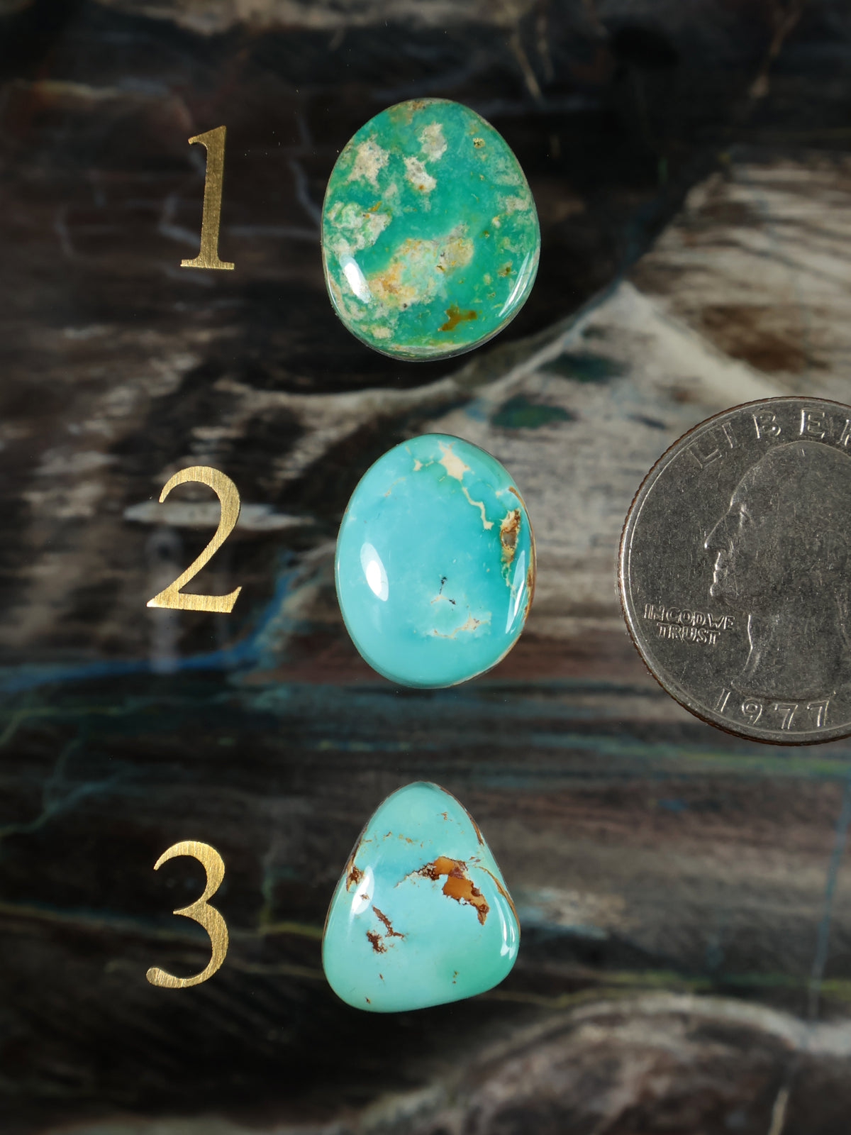 Set of three turquoise cabochon gemstones, oval and teardrop shapes