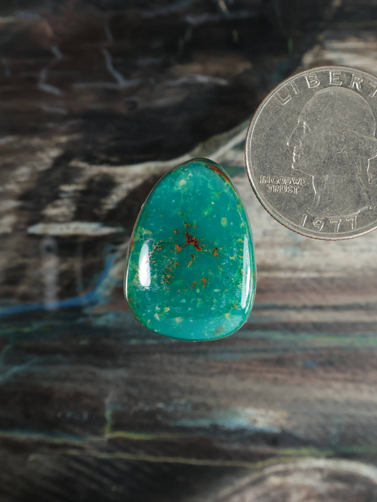 Turquoise teardrop gemstone cabochon with brown matrix flecks