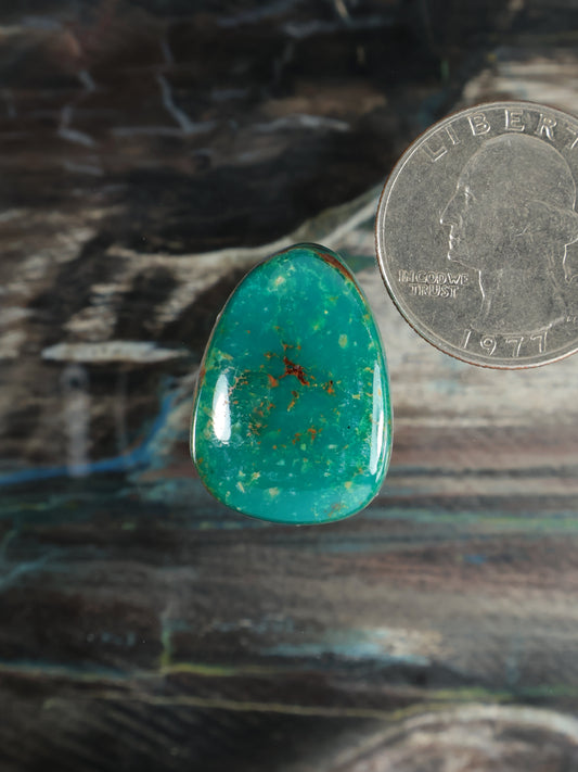 Turquoise teardrop gemstone cabochon with brown matrix flecks