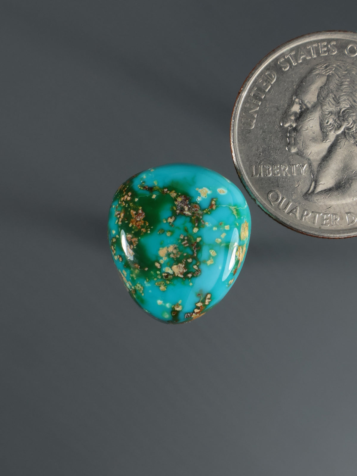 Turquoise teardrop cabochon with gold speckled pattern, small gemstone