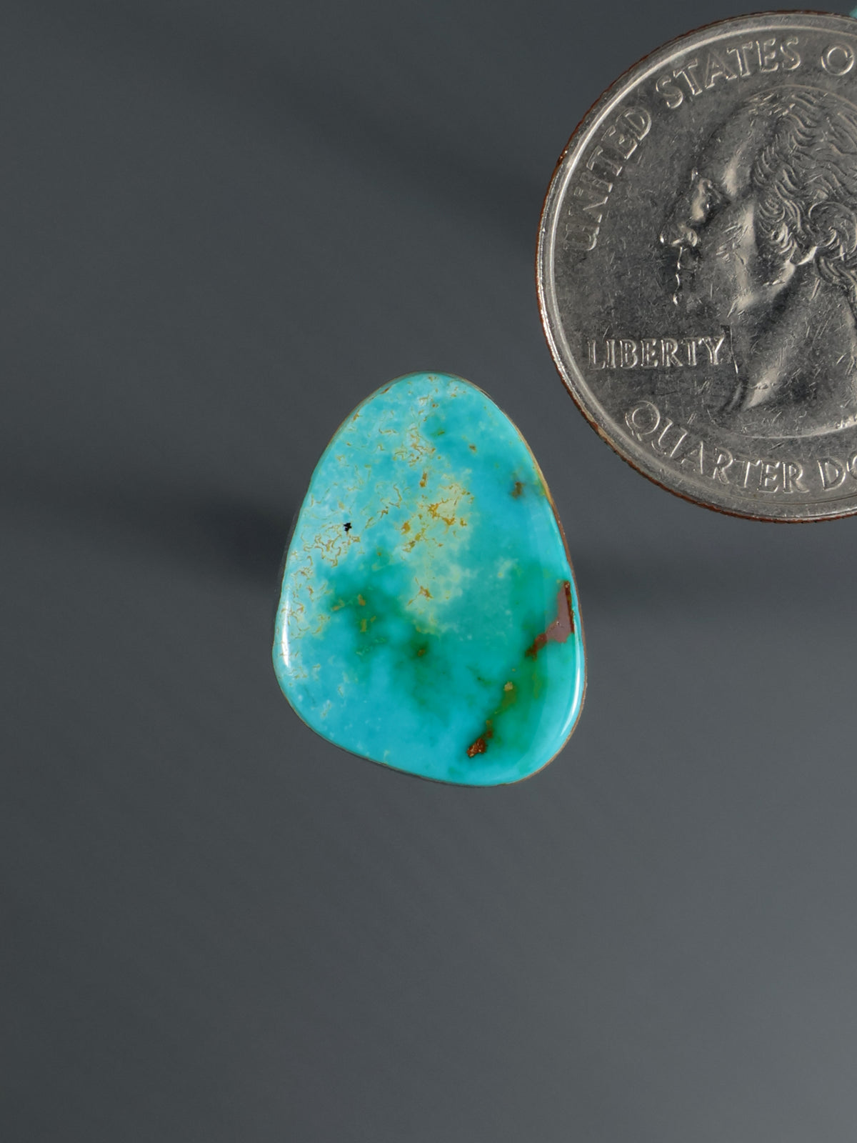 Teal blue-green teardrop cabochon gemstone with smooth polished surface