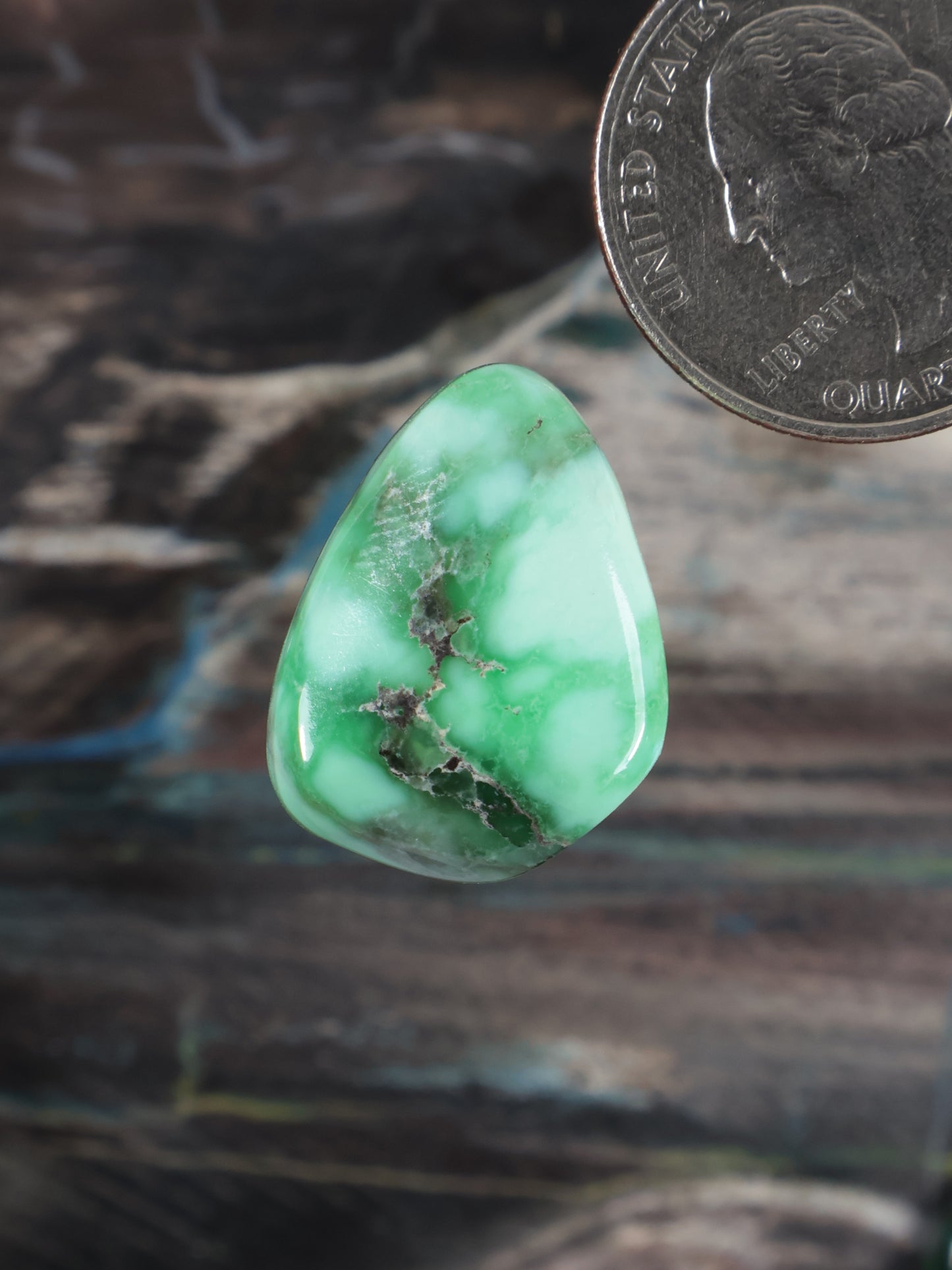 Variscite cabochon gemstone, green teardrop with dark matrix inclusions