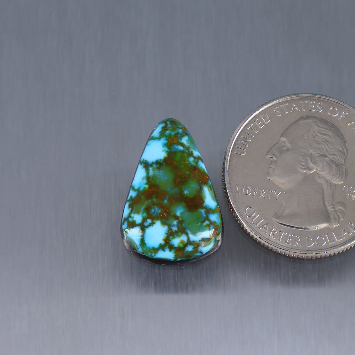 Teardrop turquoise cabochon with red web pattern, small gemstone