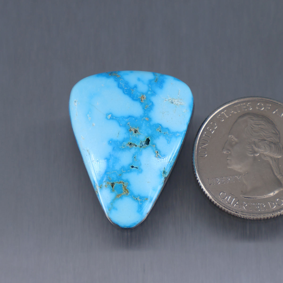 Triangular turquoise cabochon with web matrix, polished gemstone