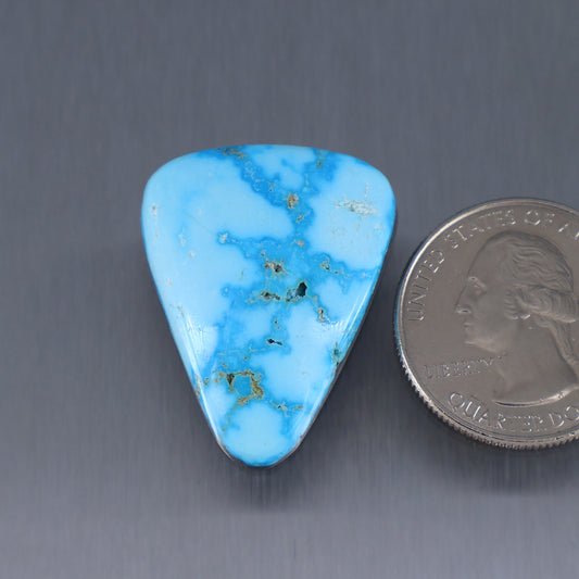 Triangular turquoise cabochon with web matrix, polished gemstone