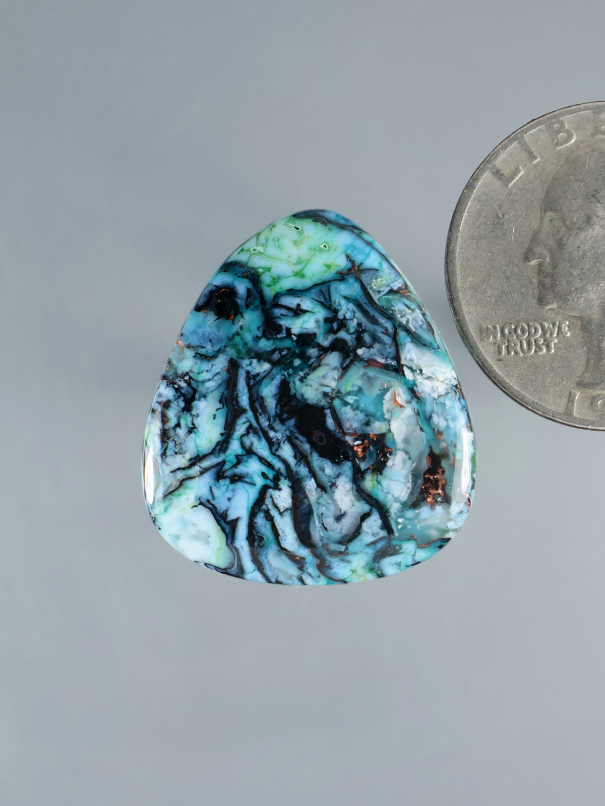 Blue-green chrysocolla chalcedony cabochon, teardrop with marbled patterns