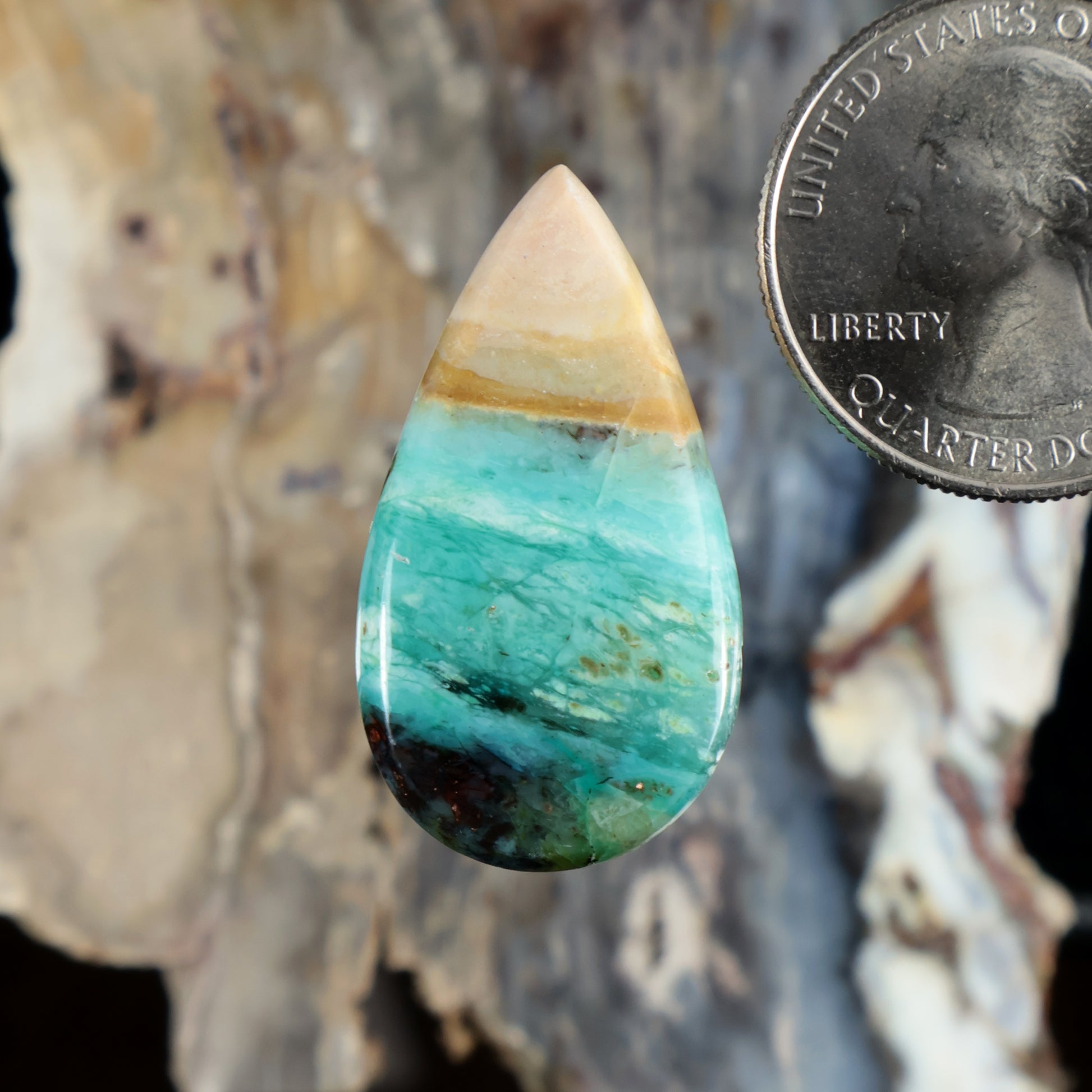 Teardrop cabochon gemstone, opalized turquoise with pale yellow banding