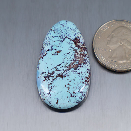 Red River turquoise cabochon, teardrop oval, light blue with dark web pattern