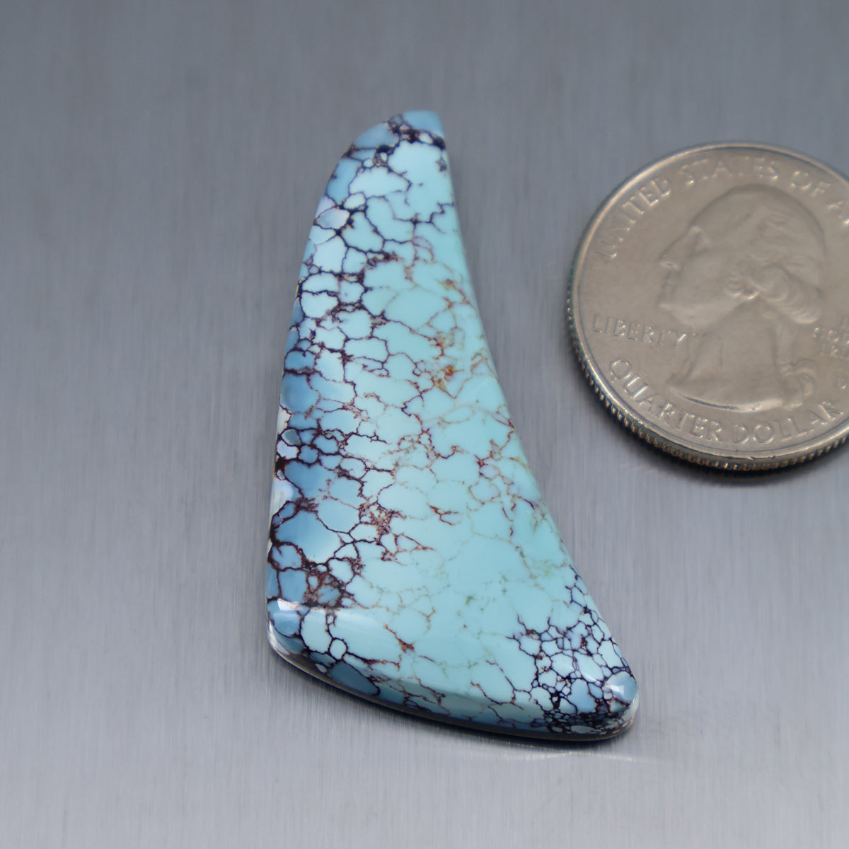 Turquoise cabochon with marbled webbing, teardrop triangle shape, smooth polished surface