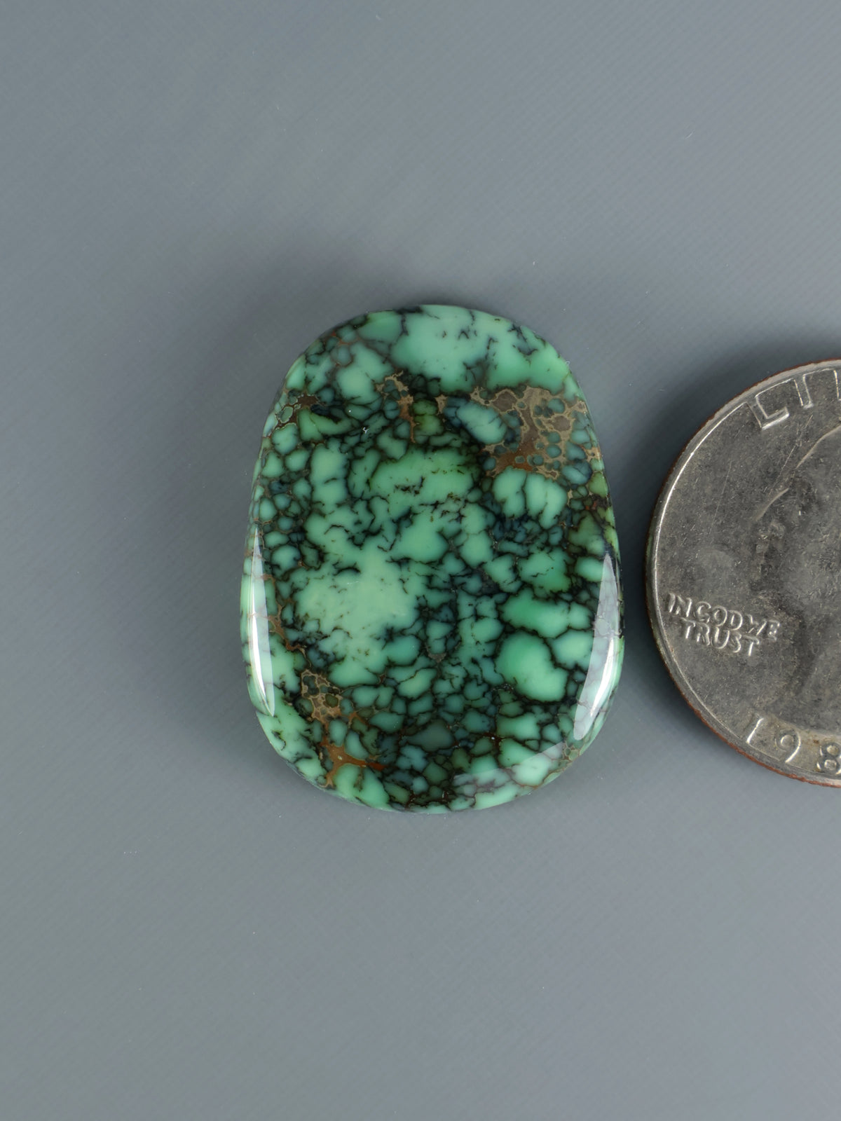 Snowville variscite cabochon, oval green turquoise stone with dark web pattern