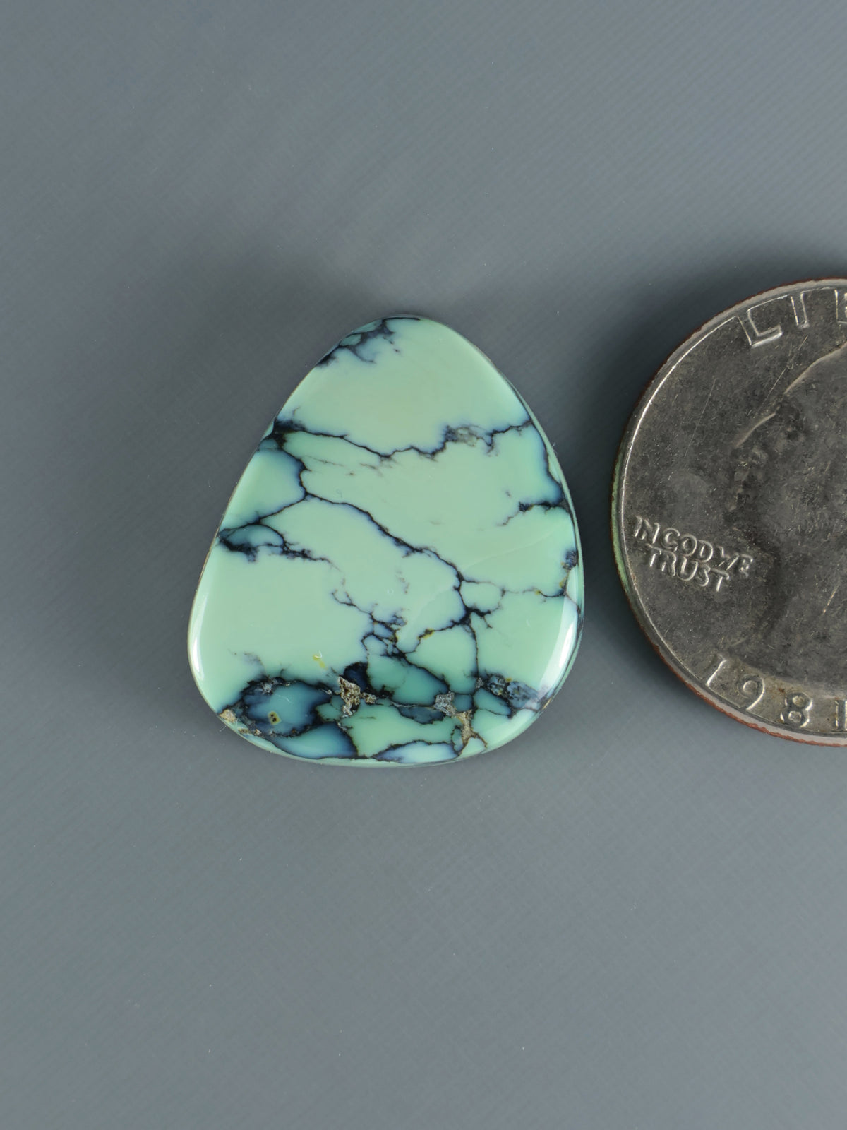 Prince Variscite cabochon teardrop with pale green base and blue vein marbling