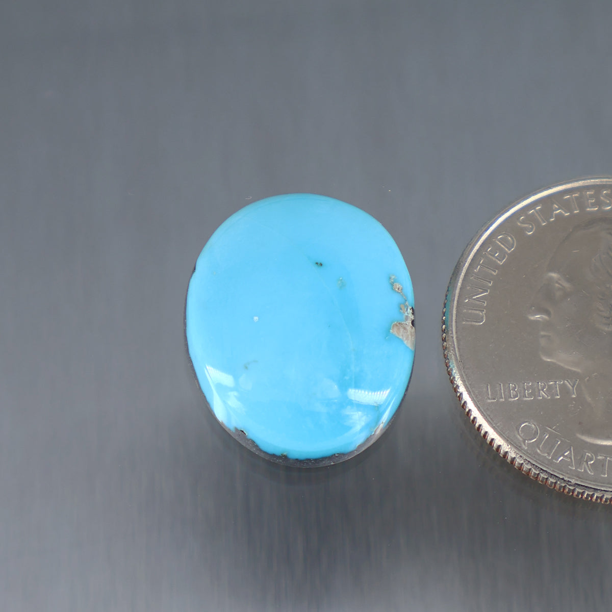 Light blue turquoise oval cabochon with silver bezel edge