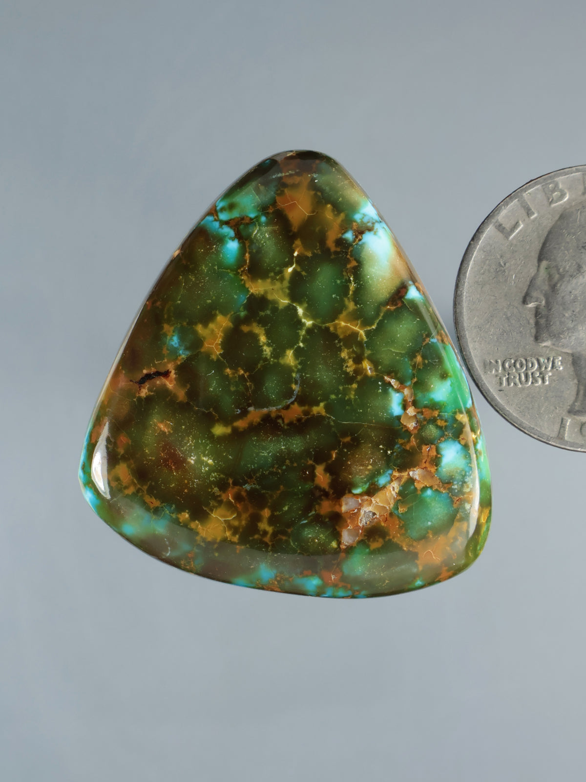 Turquoise redweb cabochon gemstone with green and brown web pattern, teardrop shape