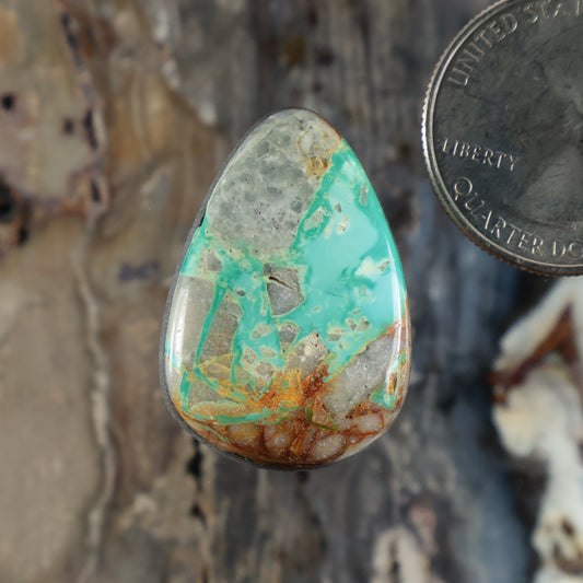 Royston turquoise cabochon teardrop gemstone with green-blue surface and brown matrix