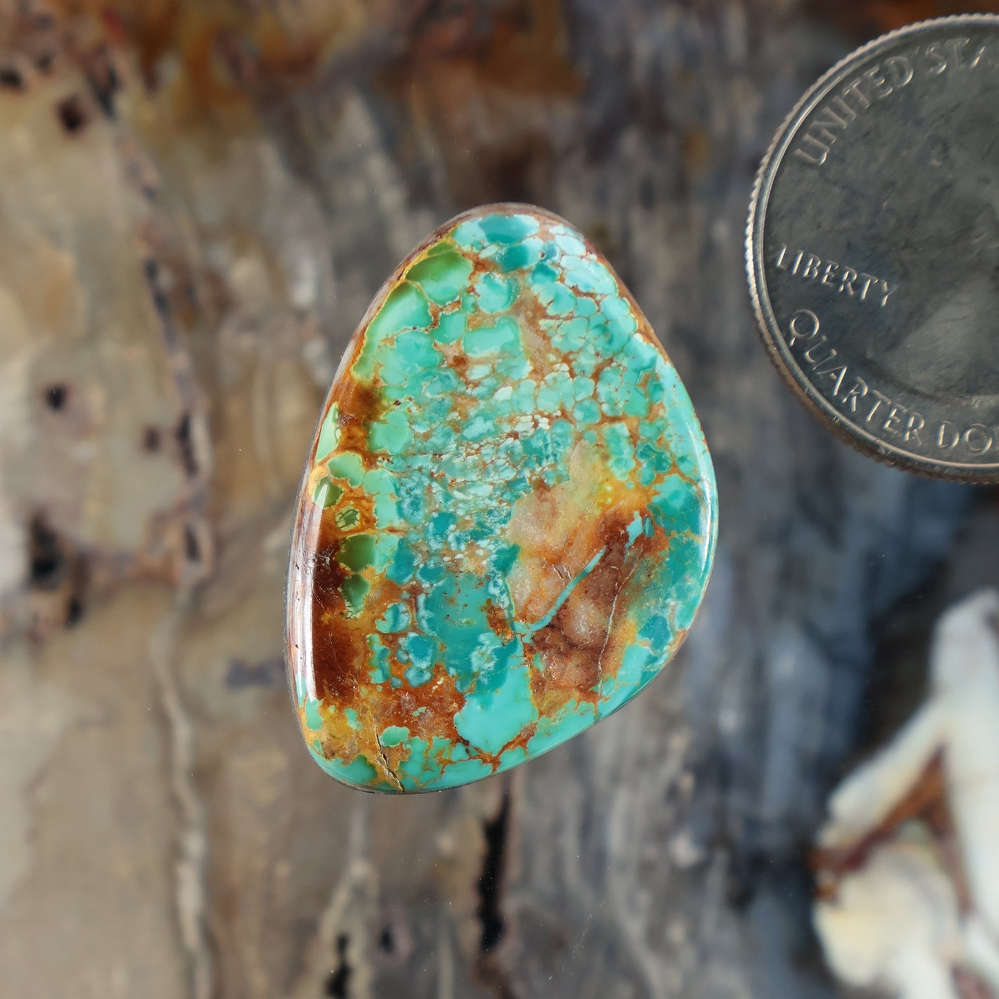 Turquoise cabochon gemstone with brown matrix, oval teardrop shape