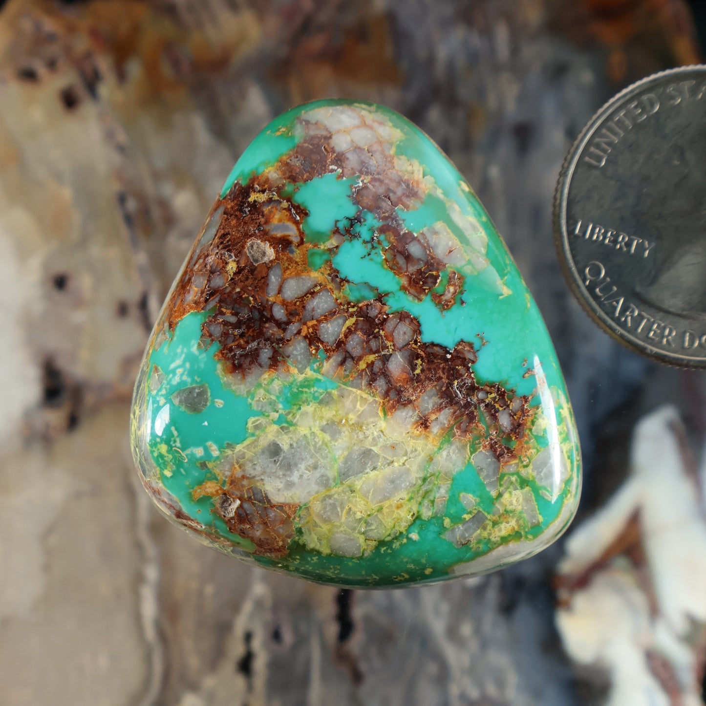 Turquoise cabochon gemstone with brown matrix veining, teardrop shape